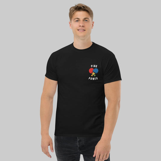 Person wearing a black t-shirt with a colorful graphic and text on a white background